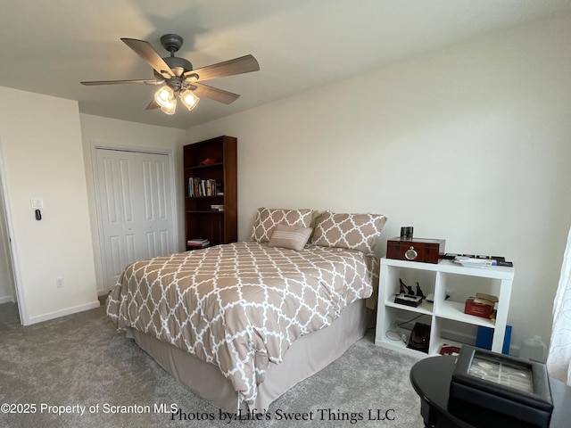 carpeted bedroom featuring a closet, baseboards, and ceiling fan