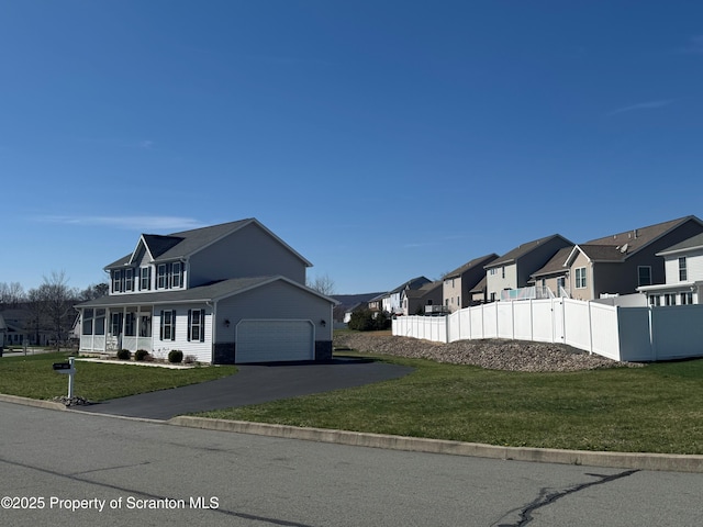 525 Poppy Ln, Moosic, PA 18507 - view of property exterior with a residential view, an attached garage, and asphalt driveway