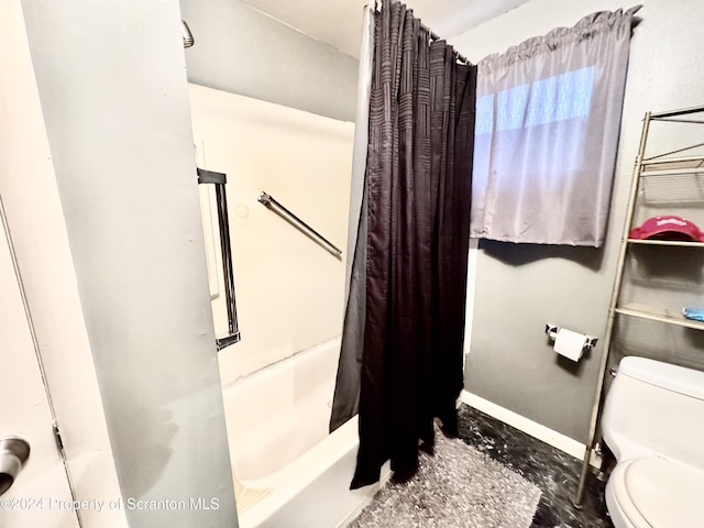 bathroom with shower / bath combo with shower curtain and toilet