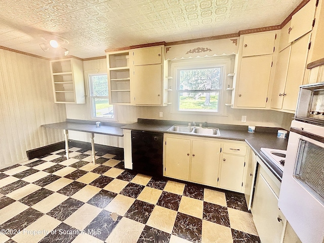 kitchen with cooktop, sink, dishwasher, and cream cabinetry