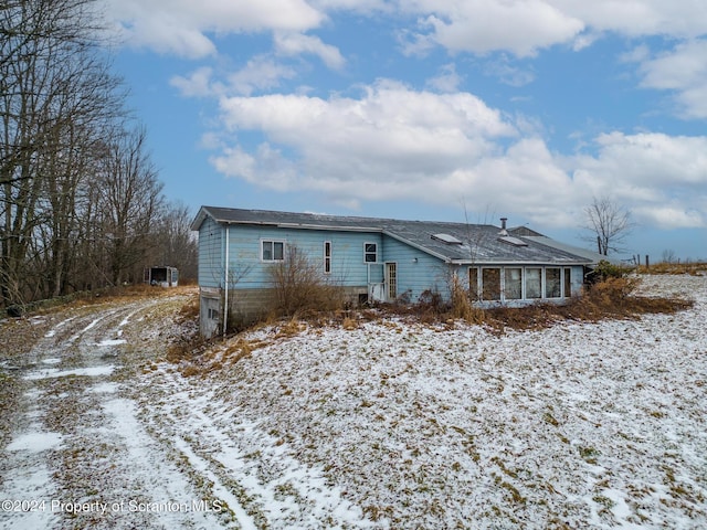 view of snow covered property