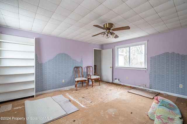 living area with ceiling fan