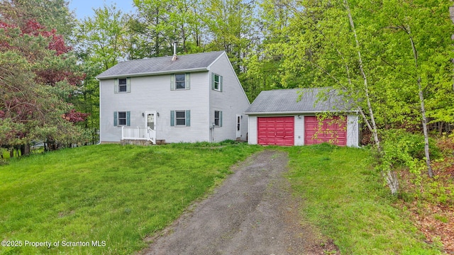 67 Smith Dr, Hallstead, PA 18822 - view of front of house with an outdoor structure, a front yard, a garage, asphalt driveway, and a shingled roof