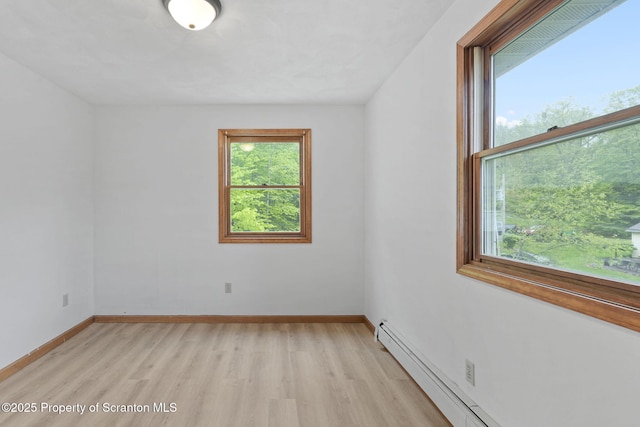 67 Smith Dr, Hallstead, PA 18822 - spare room featuring light wood-style flooring, baseboards, and a baseboard heating unit