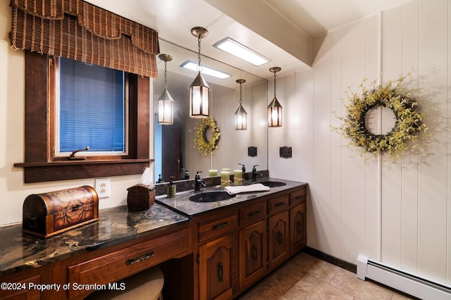 bathroom with vanity and a baseboard heating unit