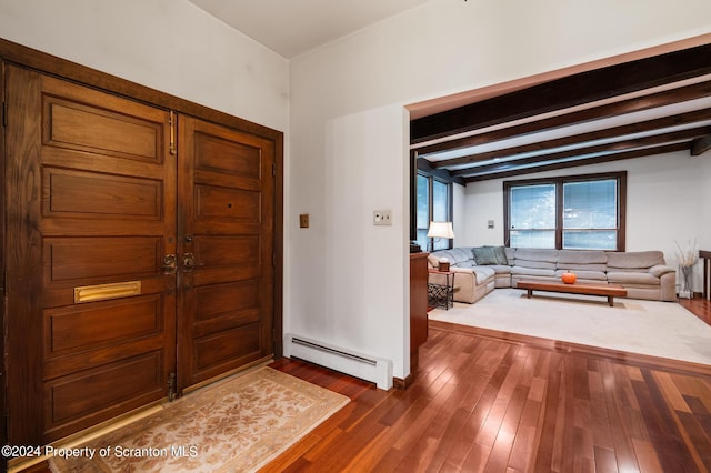 foyer entrance featuring beam ceiling, dark hardwood / wood-style flooring, and a baseboard radiator