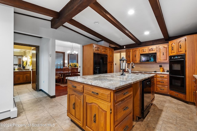 kitchen featuring a kitchen island with sink, a baseboard heating unit, black appliances, light stone counters, and a chandelier