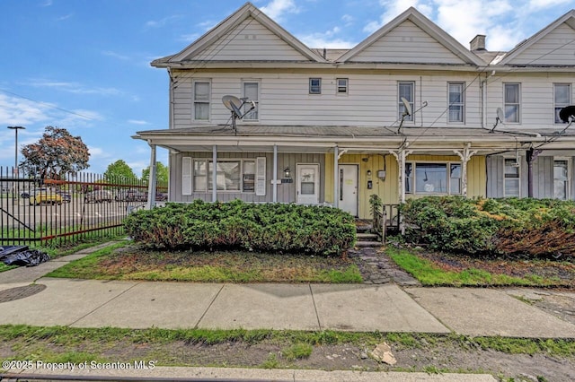 942 Providence Rd, Scranton, PA 18508 - townhome / multi-family property with board and batten siding and a porch