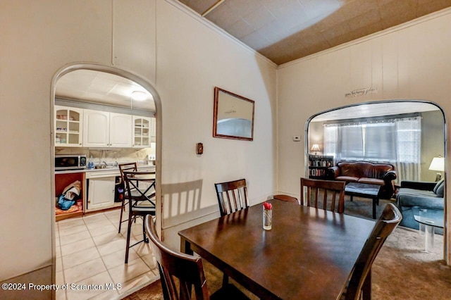 942 Providence Rd, Scranton, PA 18508 - dining area with crown molding, light tile patterned floors, and arched walkways