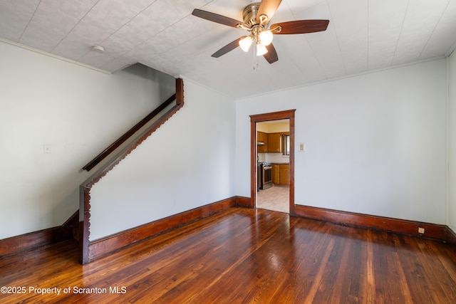 81 Rees St, Wilkes-Barre, PA 18702 - spare room with baseboards, wood-type flooring, a ceiling fan, stairway, and crown molding