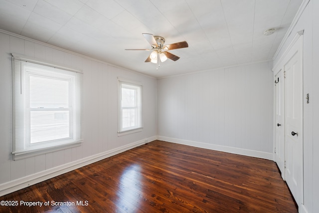 81 Rees St, Wilkes-Barre, PA 18702 - unfurnished bedroom featuring dark wood-style flooring, ornamental molding, baseboards, and ceiling fan