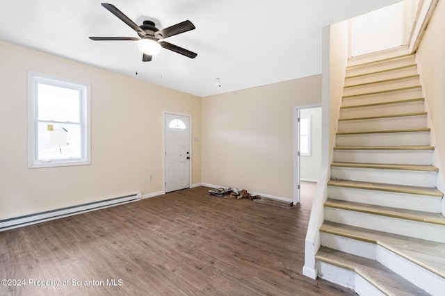 entrance foyer with dark hardwood / wood-style floors, ceiling fan, and a baseboard radiator