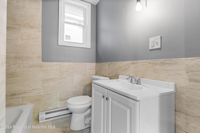 bathroom featuring a bathing tub, a baseboard heating unit, toilet, vanity, and tile walls