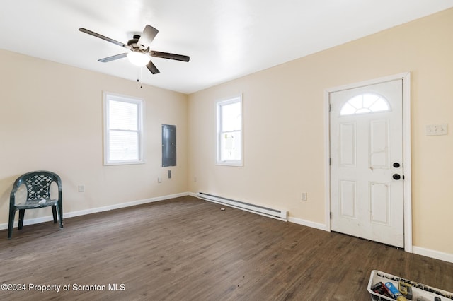 foyer entrance with dark hardwood / wood-style flooring, a baseboard radiator, ceiling fan, and electric panel