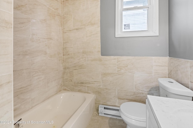 bathroom featuring vanity, a bath, toilet, and tile walls