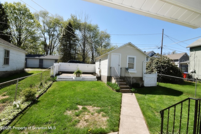 bungalow-style house featuring a gate, a front lawn, a fenced backyard, and entry steps
