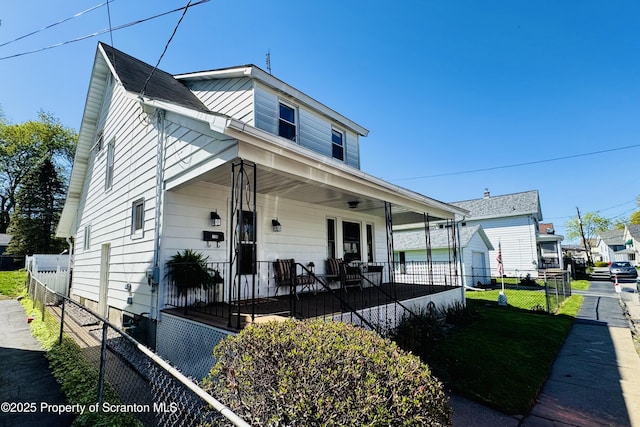 bungalow-style home featuring a porch and fence