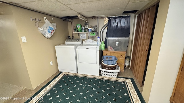 washroom featuring separate washer and dryer and laundry area