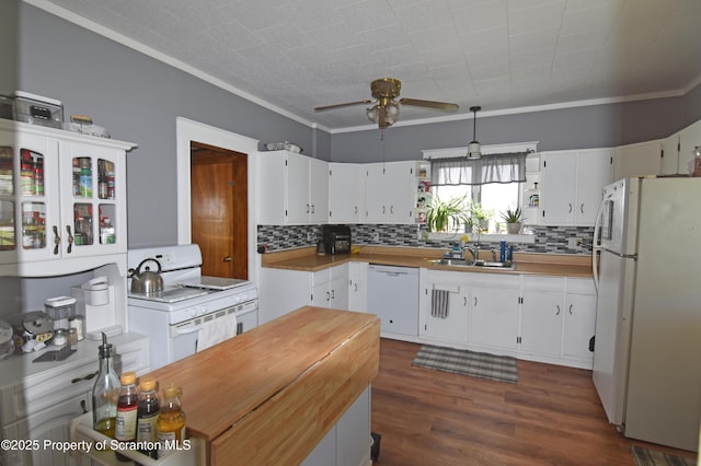 kitchen with a ceiling fan, tasteful backsplash, a sink, white cabinets, and white appliances