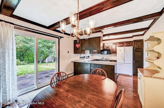 dining room with brick wall, a chandelier, hardwood / wood-style floors, and beamed ceiling