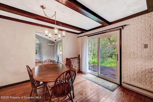 dining space with hardwood / wood-style flooring, a baseboard heating unit, a wall mounted air conditioner, a chandelier, and beam ceiling