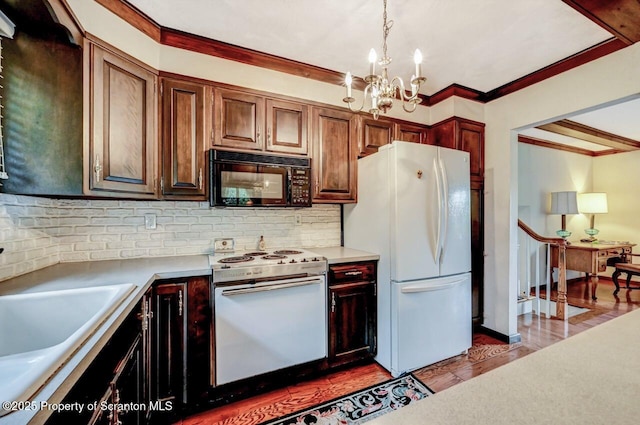 kitchen featuring white appliances, decorative light fixtures, backsplash, a chandelier, and light hardwood / wood-style flooring