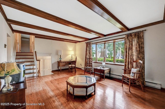 living area featuring hardwood / wood-style flooring and beam ceiling