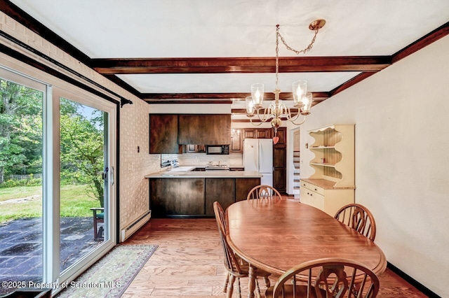 dining room with beamed ceiling, brick wall, a chandelier, and a baseboard radiator