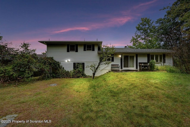 view of front of house with a yard