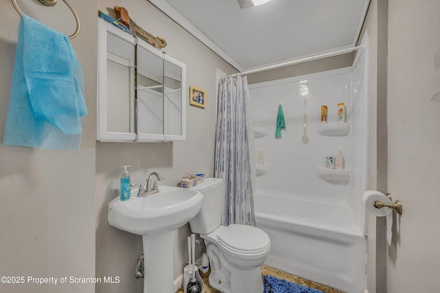 full bathroom with shower / tub combo with curtain, sink, and toilet