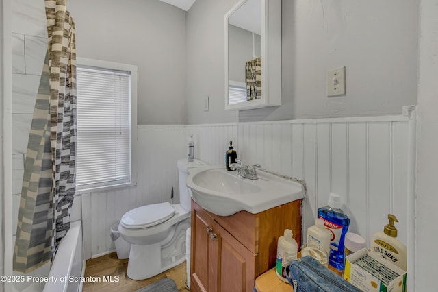 full bathroom with toilet, vanity, shower / bathtub combination with curtain, and wood-type flooring