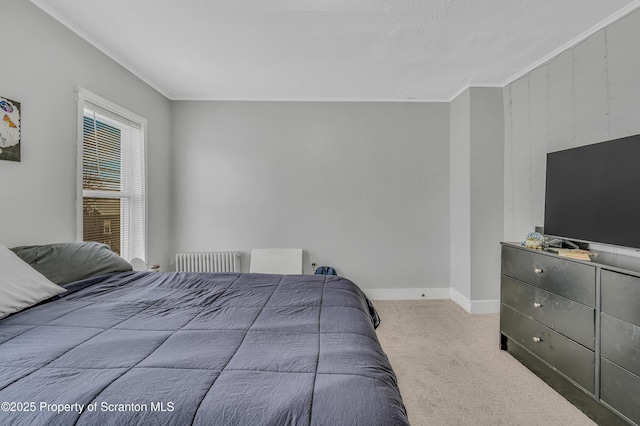 bedroom featuring light carpet, crown molding, and radiator heating unit