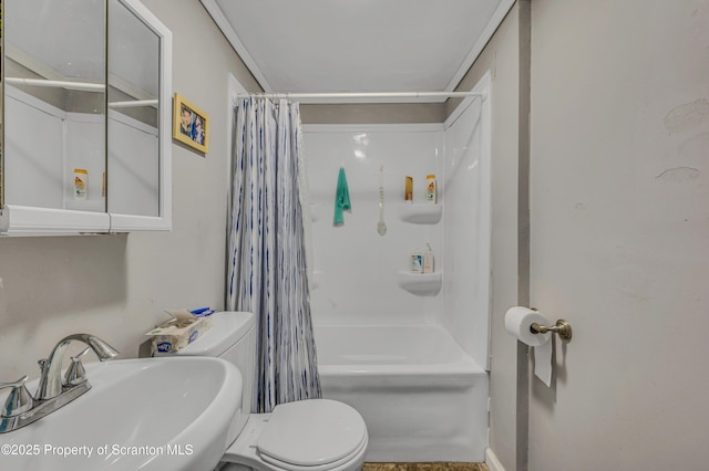 full bathroom featuring shower / tub combo with curtain, sink, and toilet