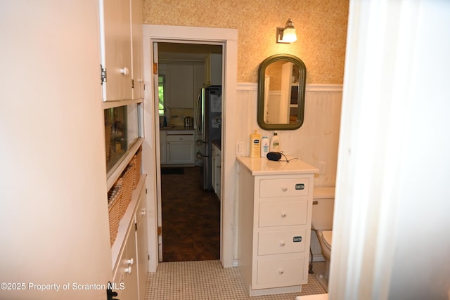 519 Sutton Rd, New Milford, PA 18834 - bathroom with wainscoting, toilet, and wallpapered walls
