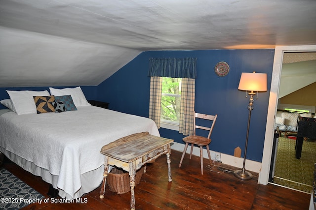 519 Sutton Rd, New Milford, PA 18834 - bedroom featuring hardwood / wood-style flooring, lofted ceiling, and baseboards