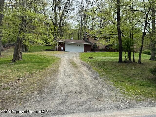 exterior space featuring dirt driveway