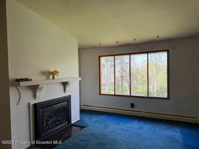 unfurnished living room featuring baseboards, dark carpet, baseboard heating, and a glass covered fireplace