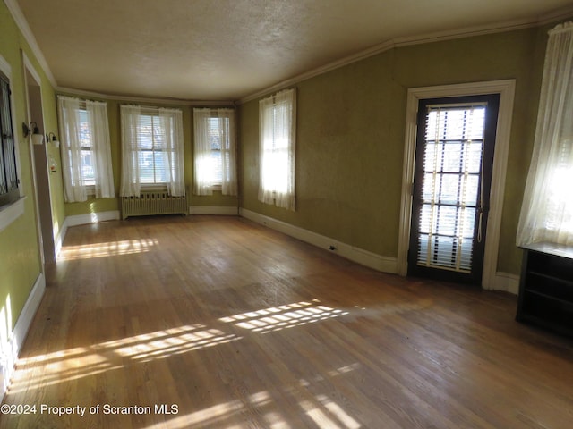 hallway with hardwood / wood-style flooring