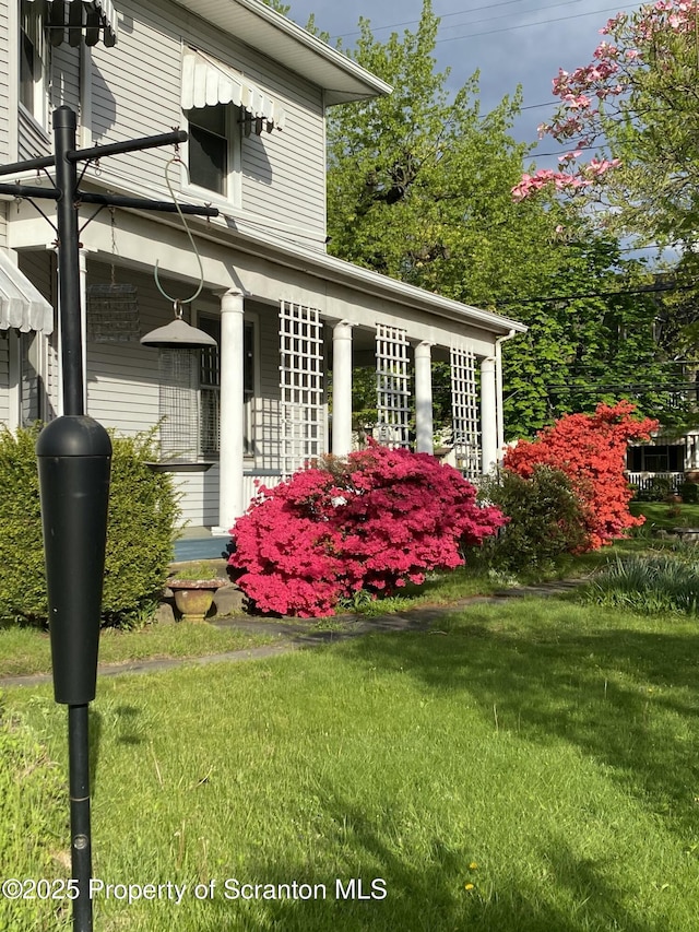 view of home's exterior with a yard