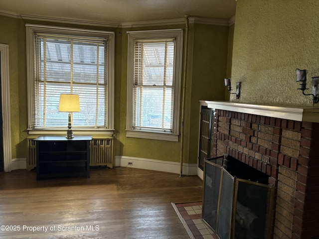 interior space featuring crown molding and wood-type flooring