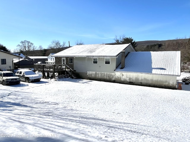 view of snow covered property