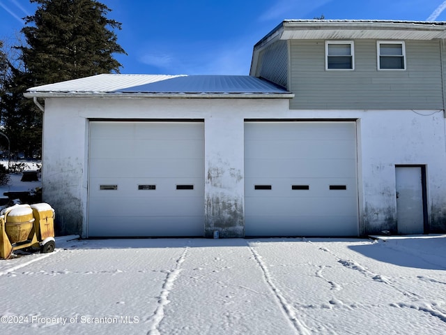 view of snow covered garage