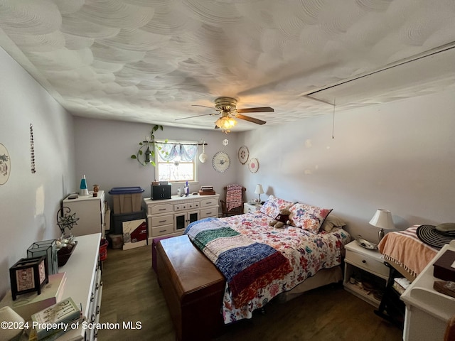 bedroom with a textured ceiling and ceiling fan