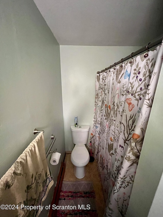 bathroom featuring toilet