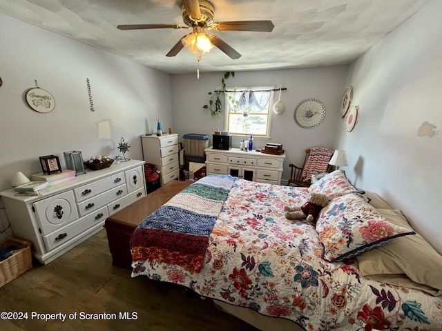 bedroom featuring dark wood-type flooring and ceiling fan