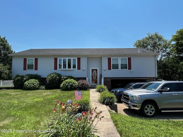 85 Cranberry Ter, Duryea, PA 18642 - bi-level home featuring an attached garage, a front yard, and brick siding