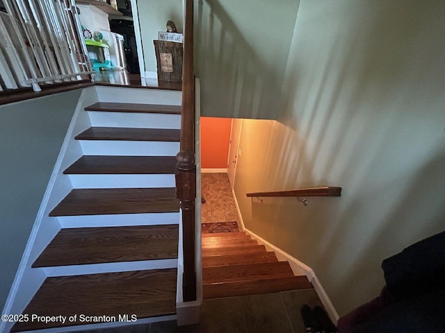 85 Cranberry Ter, Duryea, PA 18642 - stairs featuring baseboards and wood finished floors