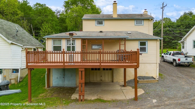 730 Chase Rd, Shavertown, PA 18708 - rear view of house with a wooden deck and a chimney
