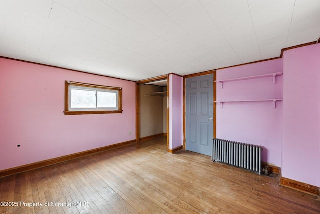 730 Chase Rd, Shavertown, PA 18708 - unfurnished bedroom with radiator heating unit, hardwood / wood-style floors, and baseboards