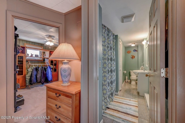 bathroom with visible vents, a ceiling fan, and a shower with shower curtain